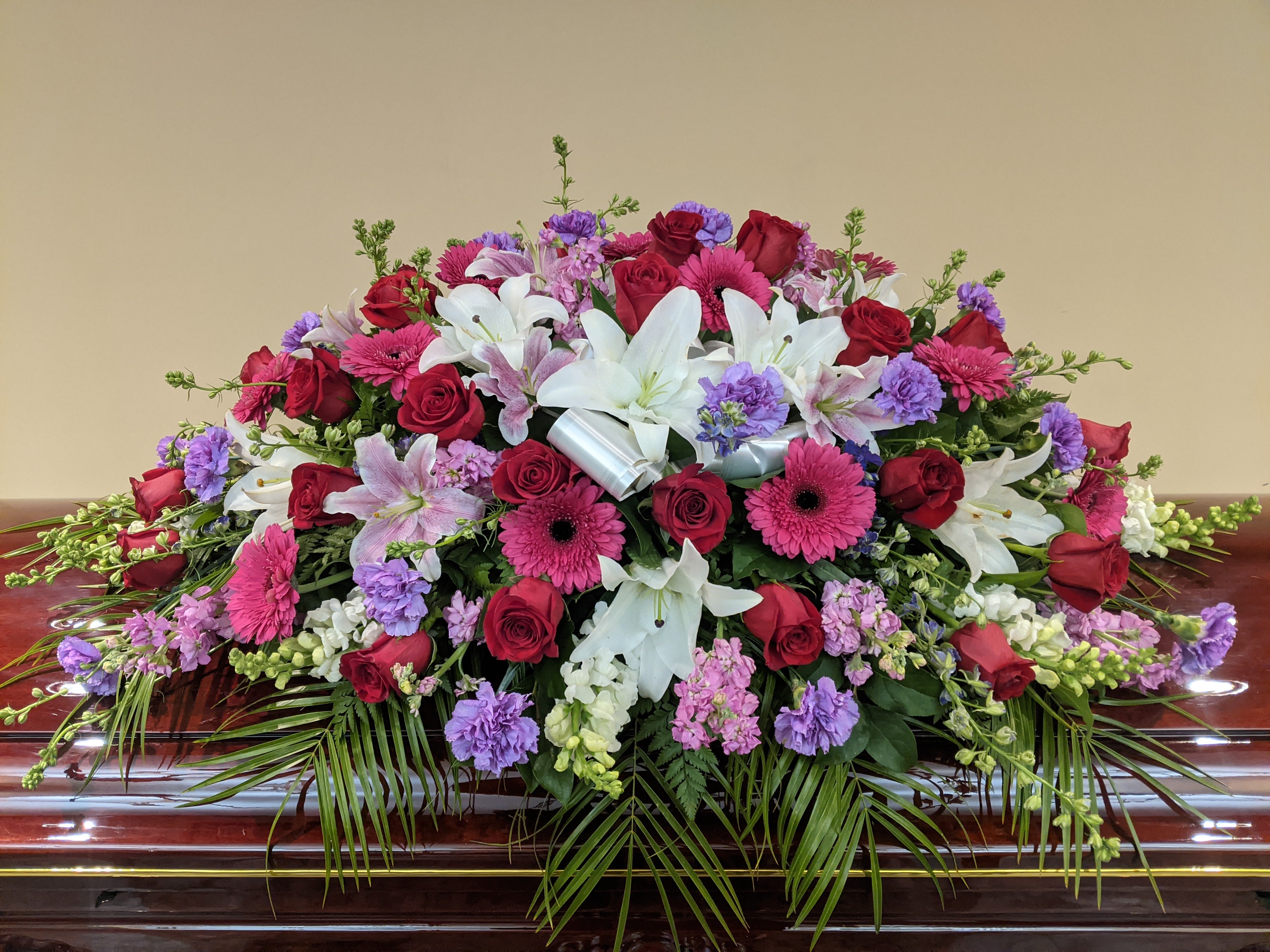 LF2- Purple and White Casket with Two Arrangements